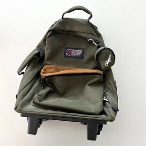 VTG Olympia Sports Plus Extending Handle Rollable Backpack